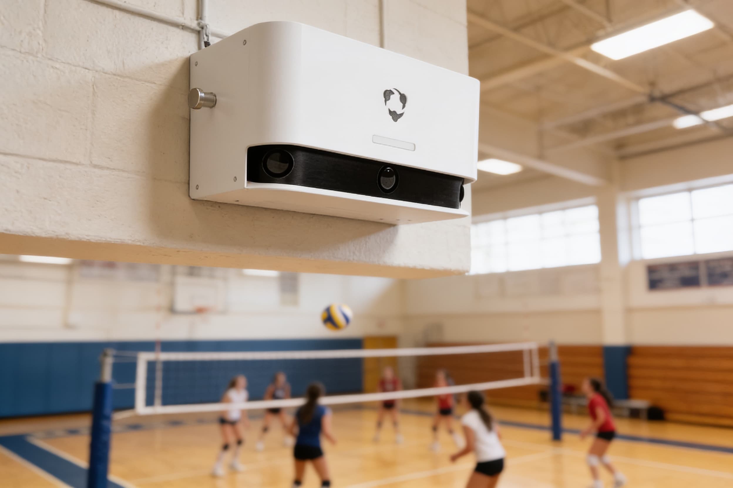 Sports camera mounted above a school gym during volleyball practice