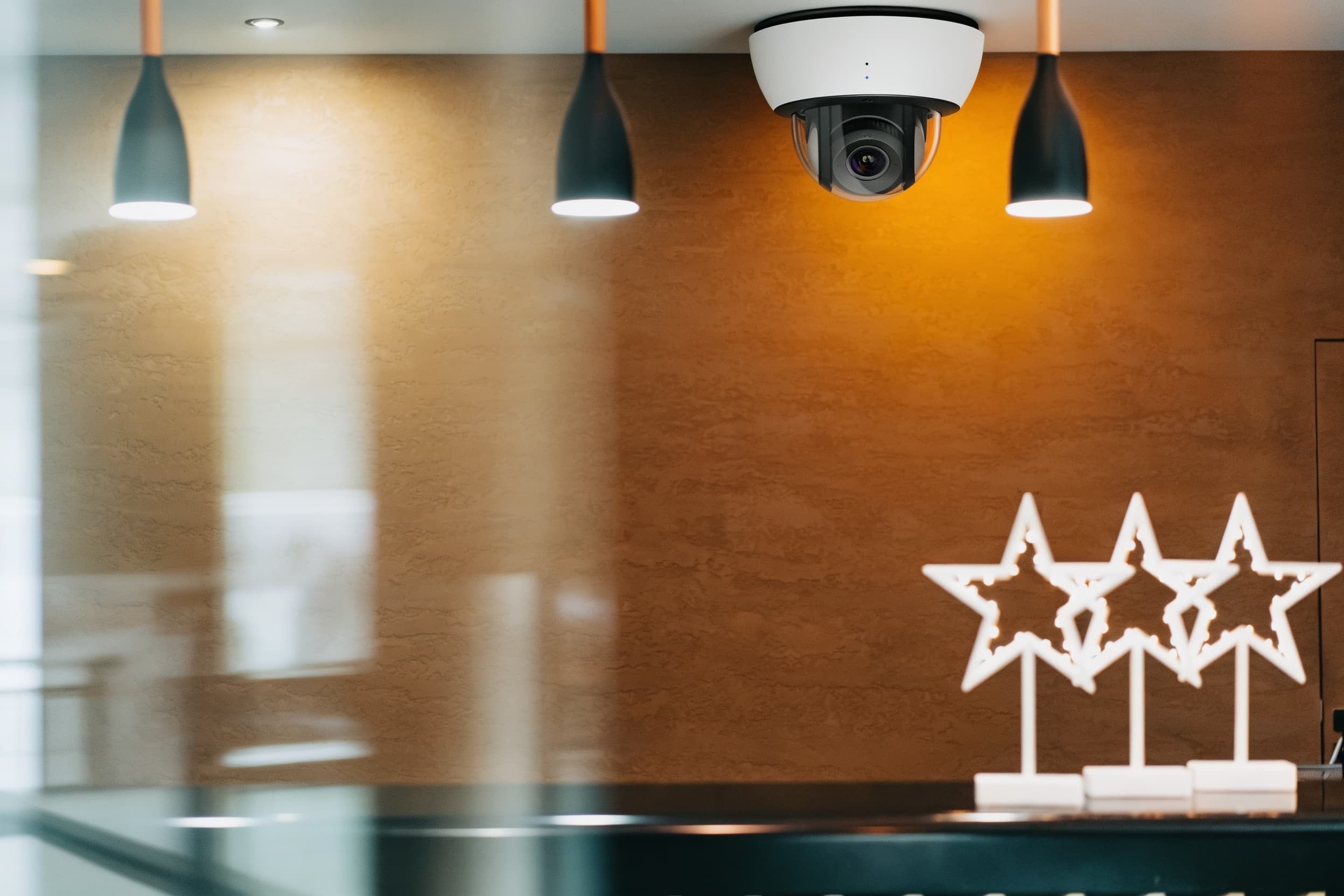 Dome security camera on a hotel lobby ceiling