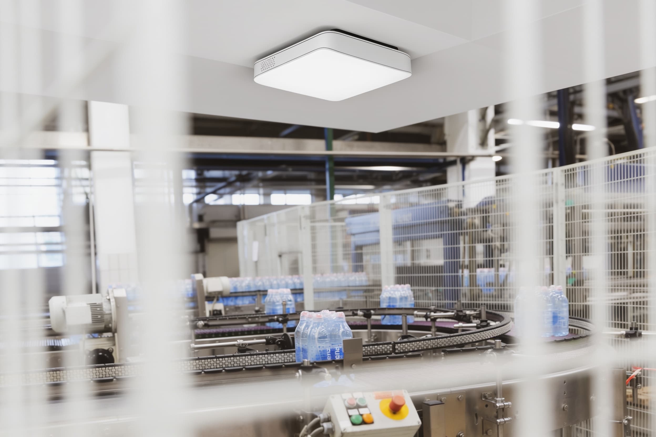 Environmental sensor mounted above a food-production packing area